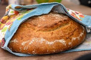 appetizing homemade whole grain bread on a wooden table 1 photo