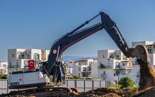 Close up details of industrial excavator working on construction site 9 photo