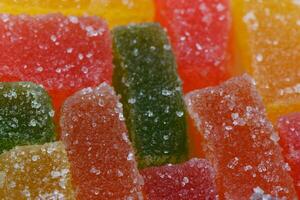 multi-colored marmalade pieces in sugar close-up photo
