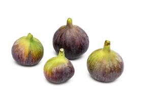 Isolated figs. One and a half fresh fig fruits isolated on white background photo