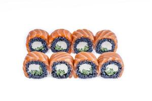 Sushi roll with black rice and salmon isolated 1 photo