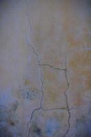 Texture, wall, concrete, it can be used as a background. Wall fragment with scratches and cracks photo