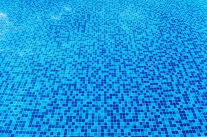 Abstract view of bottom caustics of swimming pool with ripple... photo
