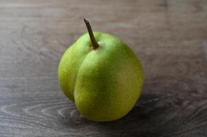 juicy pear on a wooden table 1 photo