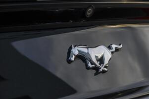 02.29.2024 Gazeveren Cyprus - Ford Mustang emblem on a black trunk lid 5 photo