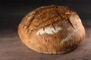 appetizing homemade whole grain bread on a wooden table 8 photo