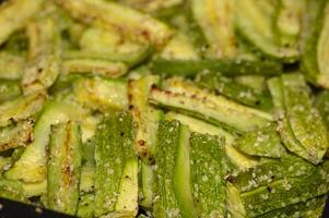 baked zucchini cut into sticks with sesame seeds cooked in the oven 1 photo