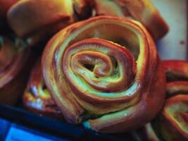 Cinnamon Buns, Curd Roll in supermarket, ready to eat, cooked and roasted. photo