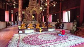 Chiang Mai, Thailand - 15th february, 2024 - Wax monk models in Wat Phra Singh. Hyperlapse sightseeing Thai culture heritage sites and popular landmarks video