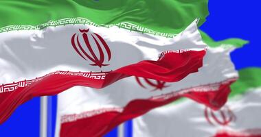 Islamic Republic of Iran national flags waving isolated on blue background video