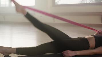 Girl Strengthens Quadriceps By Elastic Training In The Gym video