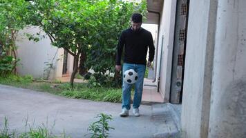 Boy Dribbles With Soccer Ball Outside video