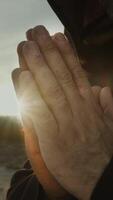 Hands Of A Monk Praying At Sunset In Countryside Nature video