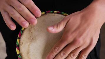 Hands Of A Musician Playing A Drum Between His Legs In Calabria video