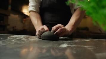 Hands Of A Chef Making The Black Ink Squid Dough At Restaurant Table video