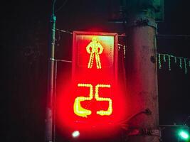 night traffic light for pedestrians with number 25, twenty five photo