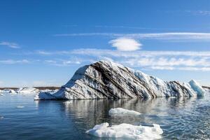 panorama of icebergs floating in the blue lagoon photo