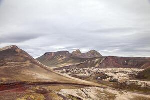 majestic lunar landscape of volcanic hills in Landmannalaugar region photo