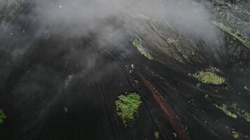 enduro motorcycles ride Batur volcano drone view mist video