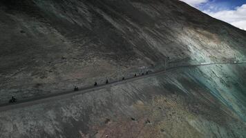 Motorcyclists riding on a mountain road video