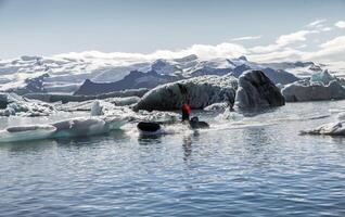 motor boat sailing on the azure waters between the blue lagoon photo