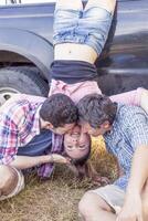 group of young adults make crazy and kisses photo