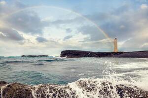 White lighthouse on the extreme west coast of Iceland. photo