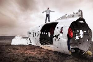 group of friends having fun walking over a plane photo