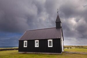 the famous black church of Budir in Iceland photo