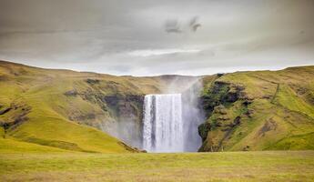 panorama of the majestic skogafoss waterfall photo