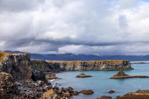 landscape of the rocky and jagged coastline photo