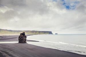 panoramic view of the majestic stack on the black beach photo