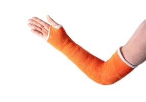 hand in an orange fiberglass cast after a fracture of the wrist bones for fixation on a white background, modern methods of treatment, high quality photo