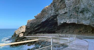 Cave of Achbinico, Sanctuary rock in Candelaria, Canary Island, Rocky coast, Tenerife photo