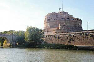 Rome, Italy - September 13 2022 Sant'Angelo Castel or Castello Angelo and the Tiberis or Tevere River in Rome, Italy photo