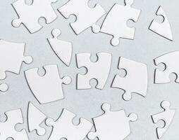 Jigsaw puzzle pieces connecting on abstract pattern background, business challenge solution concept photo