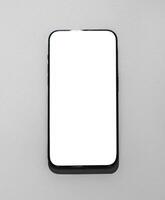Modern mobile phone, blank screen smartphone. White technology device, empty communication telephone photo