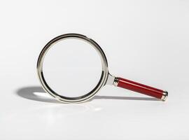 Magnifying glass for detailed research, zoom on documents. Science and business study, inspecting photo