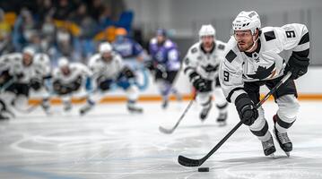 Hockey players in black and white uniforms at the hockey arena during the match. Copy space photo