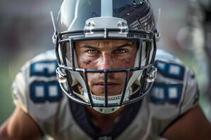 American football player in a gray helmet and white uniform.it is worth focusing on manufacturing. Close-up of the face photo