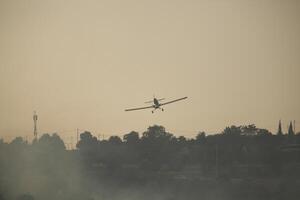 Air Tractor AT-802 Fire fighting Aircraft puts out a forest fire photo