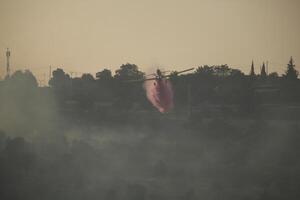 Air Tractor AT-802 Fire fighting Aircraft puts out a forest fire photo