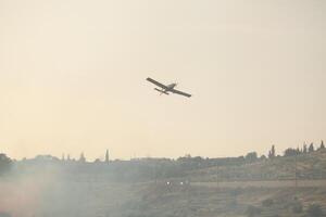 Air Tractor AT-802 Fire fighting Aircraft puts out a forest fire photo