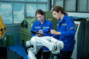 un grupo de robótica ingenieros trabajando con programación y manipulando robot mano, industrial robótica diseño, alto tecnología instalación, moderno máquina aprendiendo. masa producción automáticas. foto