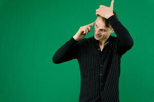 man talking on mobile phone over a green screen background photo