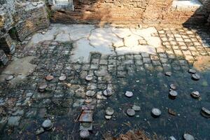 Ruins of the Great Basilica in Butrint National Park, Buthrotum, Albania. Triconch Palace at Butrint Life and death of an ancient Roman house Historical medieval Venetian Tower surrounded photo