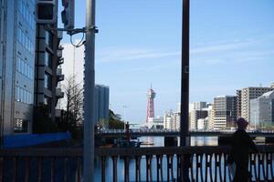 Fukuoka, Japan - December 10, 2023 - View of the Hakata Port Tower a red lattice metal observation tower in the Hakata district of Fukuoka, Japan photo