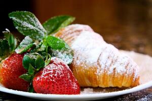 Continental breakfast with fresh croissants, orange juice and coffee, selective focuse. photo