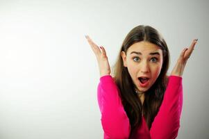 The girl crossed two fingers near her head and is very worried that everything will work out sincere smile beautiful teeth fresh good She has emotionally positive emotions long live natural hair pink photo