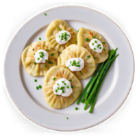 uma prato do pierogis coberto com picado cebolinha e uma dallop do azedo creme em a lado png